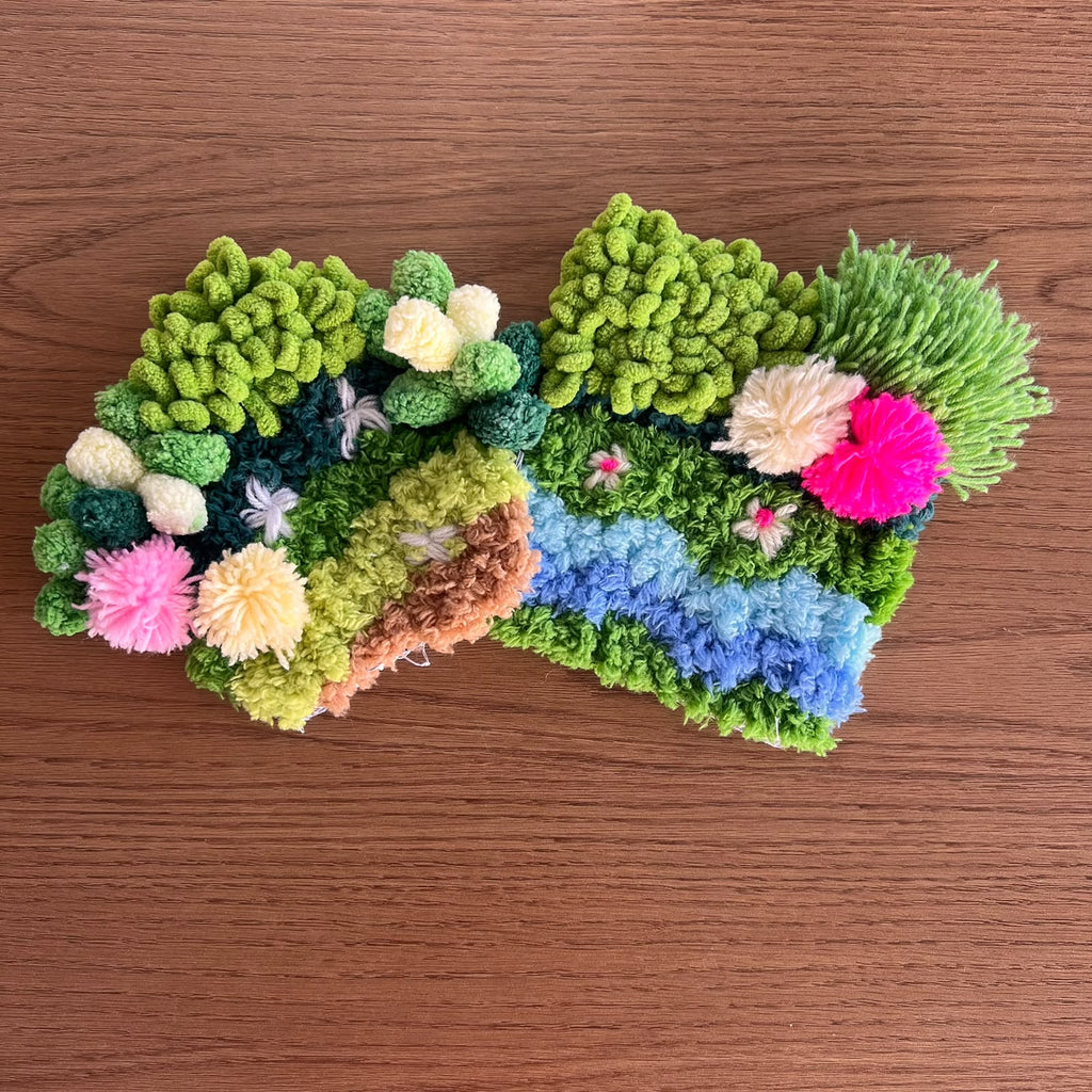 Two handmade moss coasters in rich green tones, Moss Muse and Monsoon Magic Moss, with an earthy, natural look. Set of two DIY kits by Otter's Art.