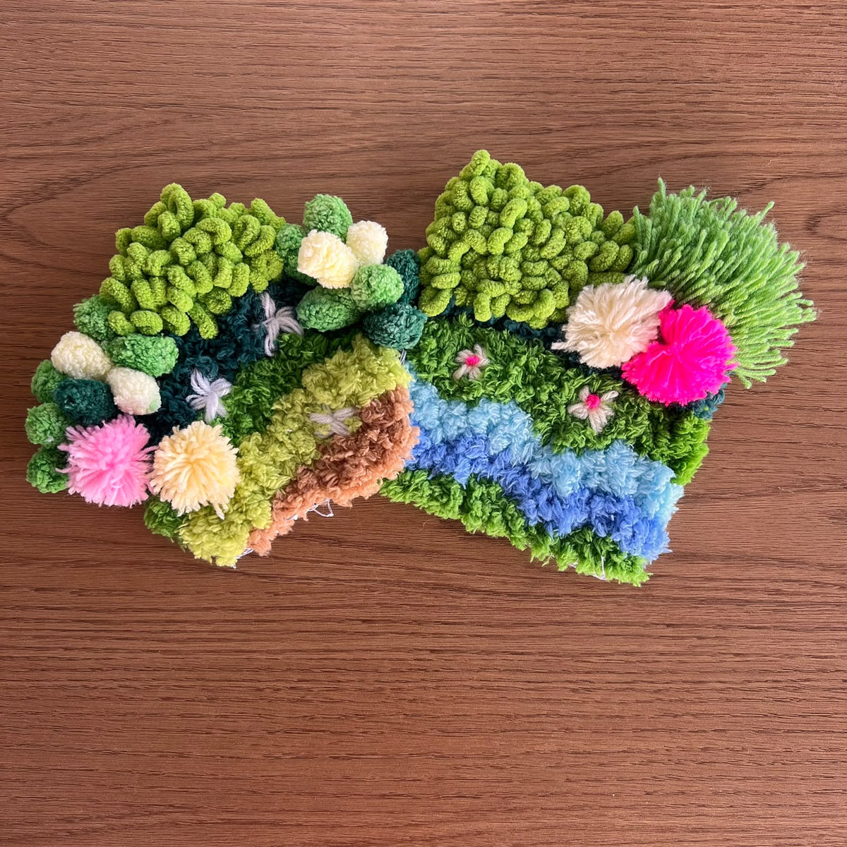 Two handmade moss coasters in rich green tones, Moss Muse and Monsoon Magic Moss, with an earthy, natural look. Set of two DIY kits by Otter's Art.